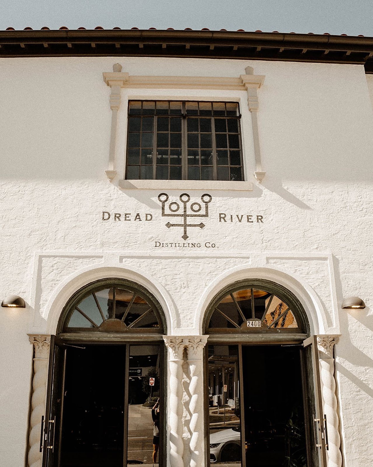 An outdoor-shot of Alabama’s finest distillery, Dread River Distilling Company.
