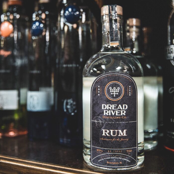 A close-up of a bottle of rum from Dread River Distilling Co., showcasing its label and premium craftsmanship.