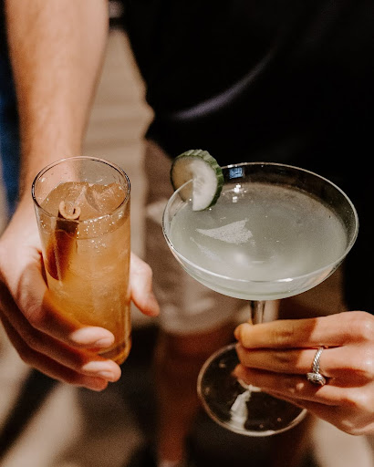 A bartender serves two vodka-based cocktails crafted with vodka from Dread River Distilling Co.
