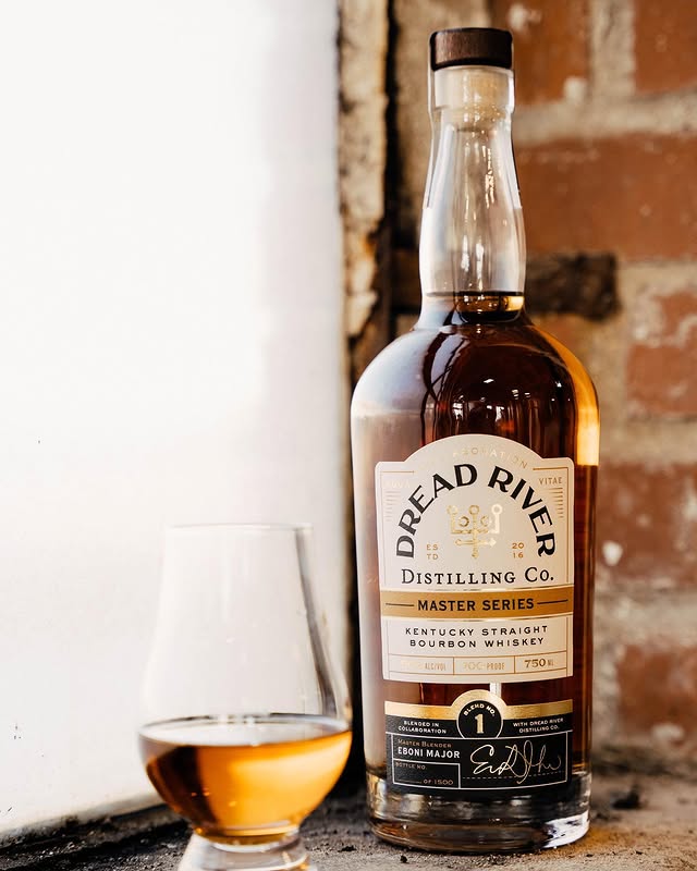 Bottle of Dread River Distilling Co. Kentucky Straight Bourbon Whiskey from the Master Series, with a glass of whiskey beside it.