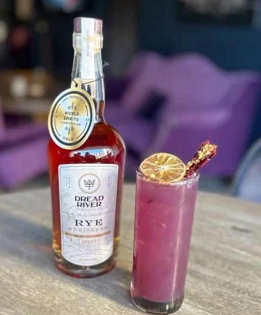 A bottle of Dread River Distilling Co’s Rye Whiskey, highlighting its unique bottle shape and sophisticated label design.
