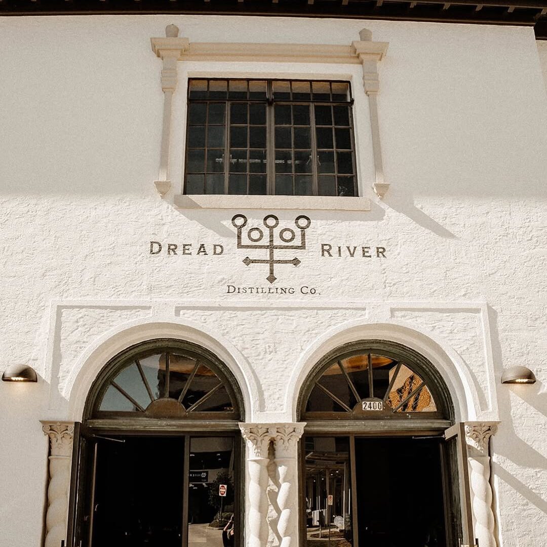 Outdoor shot of Dread River Distillery’s architecturally elegant entrance.