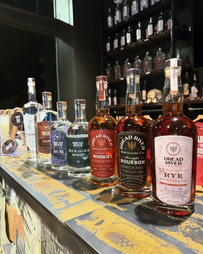 A lineup of Dread River spirits, including vodka, gin, rum, blue agave spirit, whiskies, bourbon, and rye whiskey.