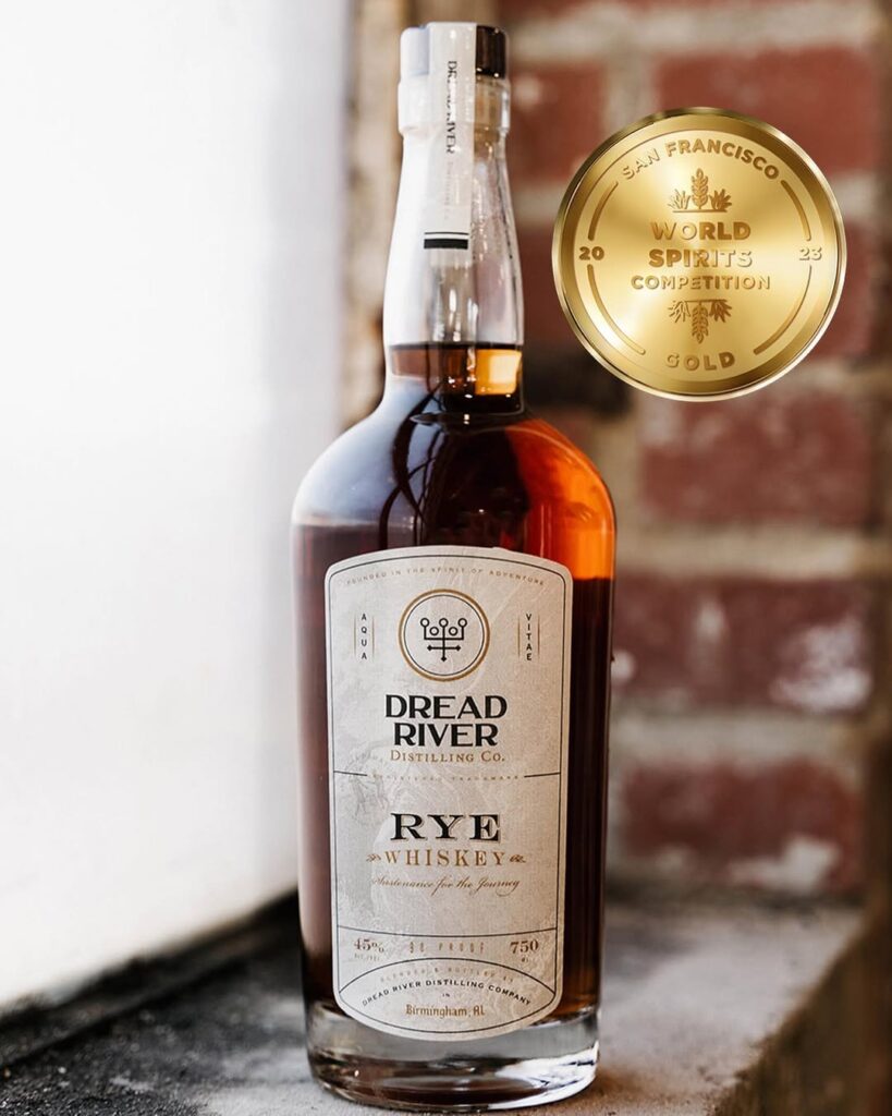 A bottle of Dread River Rye Whiskey by the window side.