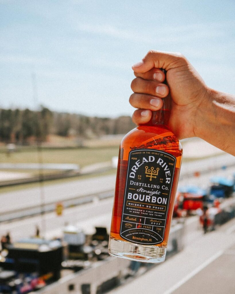 A person holds Dread River Distillery’s Straight Bourbon Whiskey.