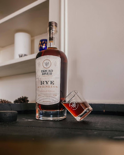 Close-up of a premium rye whiskey bottle highlighting rich amber color and label detail.