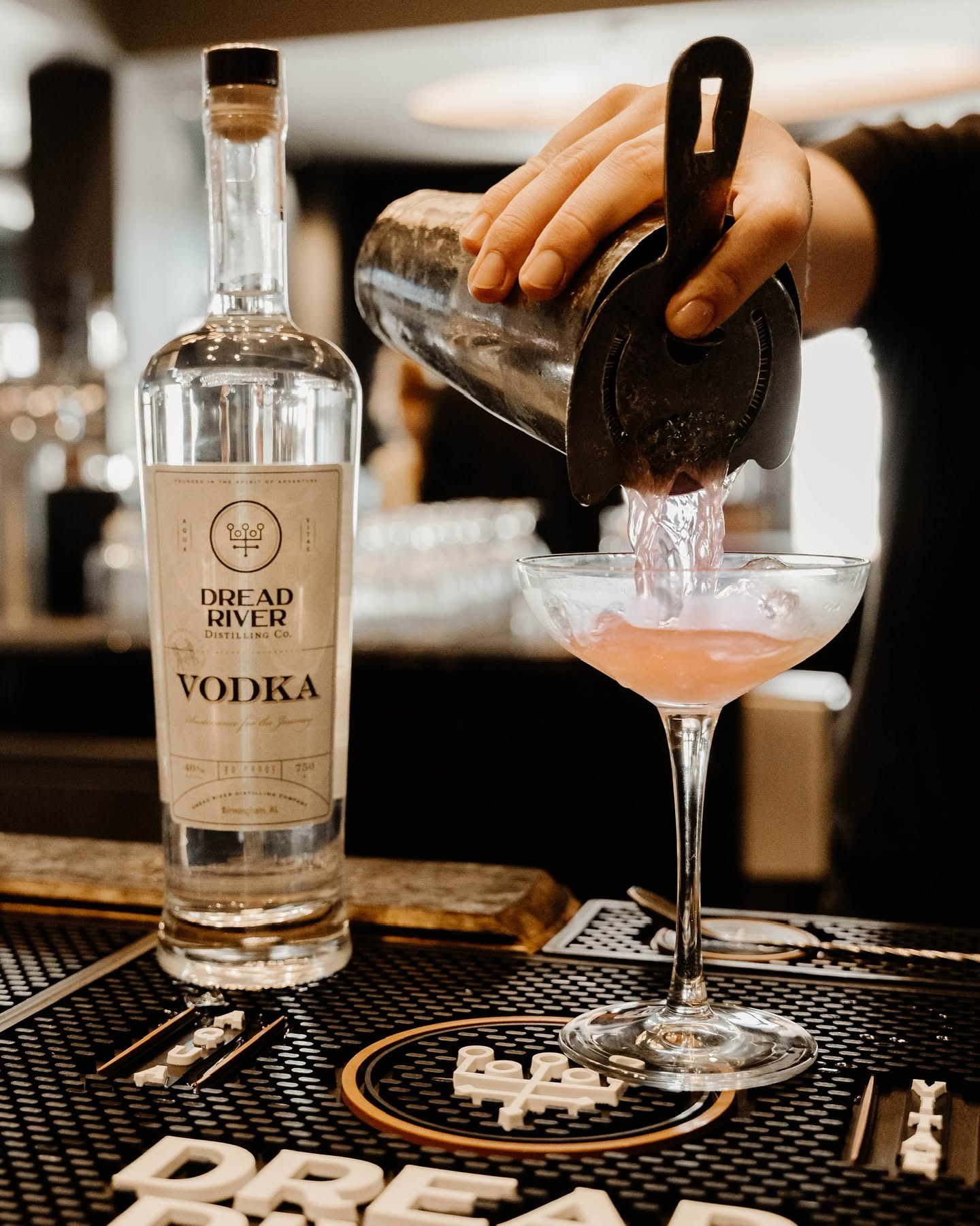 Bartender strains drink