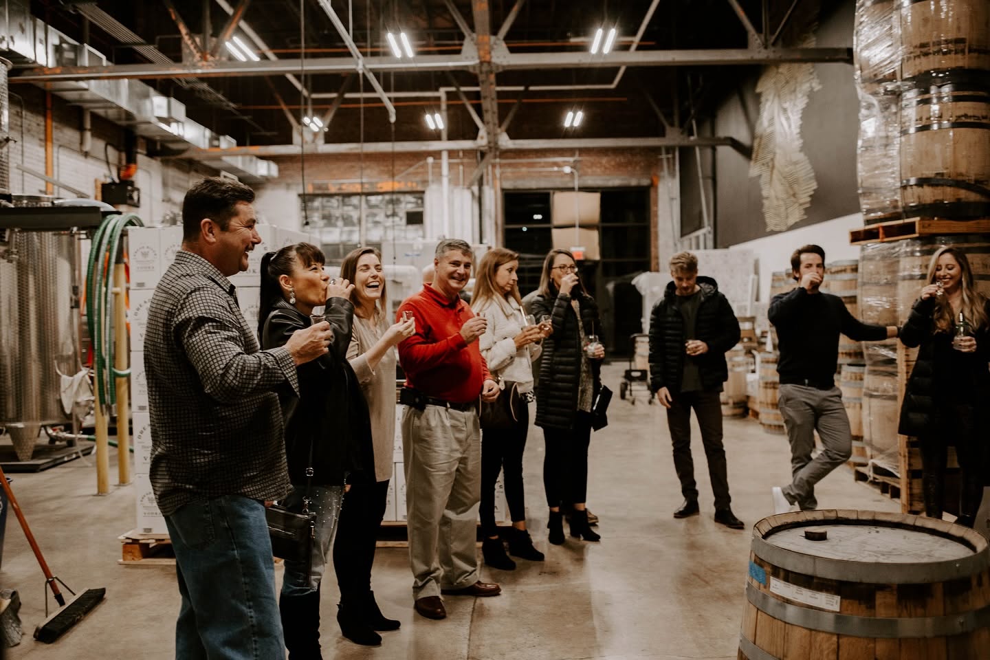 Guests sampling spirits together during a Dread River distillery tour.